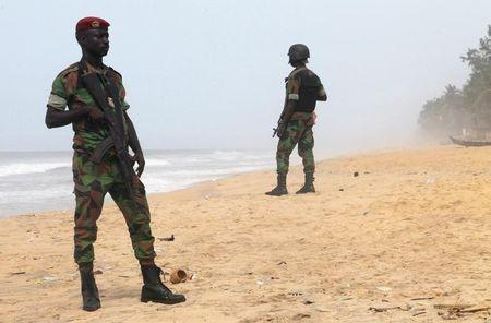 Soldiers stand guard on the beach following an attack by gunmen from al Qaeda's North African branch, in Grand Bassam, Ivory Coast, March 14, 2016. REUTERS/Luc Gnago