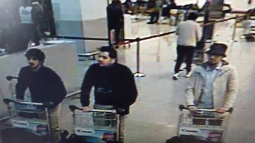 The suspects at the airport. Ibrahim El Bakraoui is in the middle of the image; the other two men have not yet been identified.
