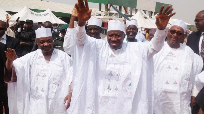 PIC.2. FROM LEFT: VICE PRESIDENT NAMADI SAMBO; PRESIDENT GOODLUCK JONATHAN AND PDP CHAIRMAN, ADAMU MU'AZU, WAVING TO THE CROWD DURING DECAMPING CEREMONY OF ATTAHIRU BAFARAWA FROM APC TO PDP IN SOKOTO ON SATURDAY (8/2/14). 794/8/2/14/AAG/NAN