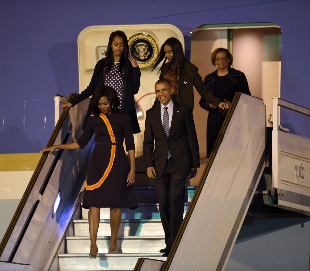 Michelle Obama stepped off the plane in a modest but bold printed dress by Narciso Rodriguez.