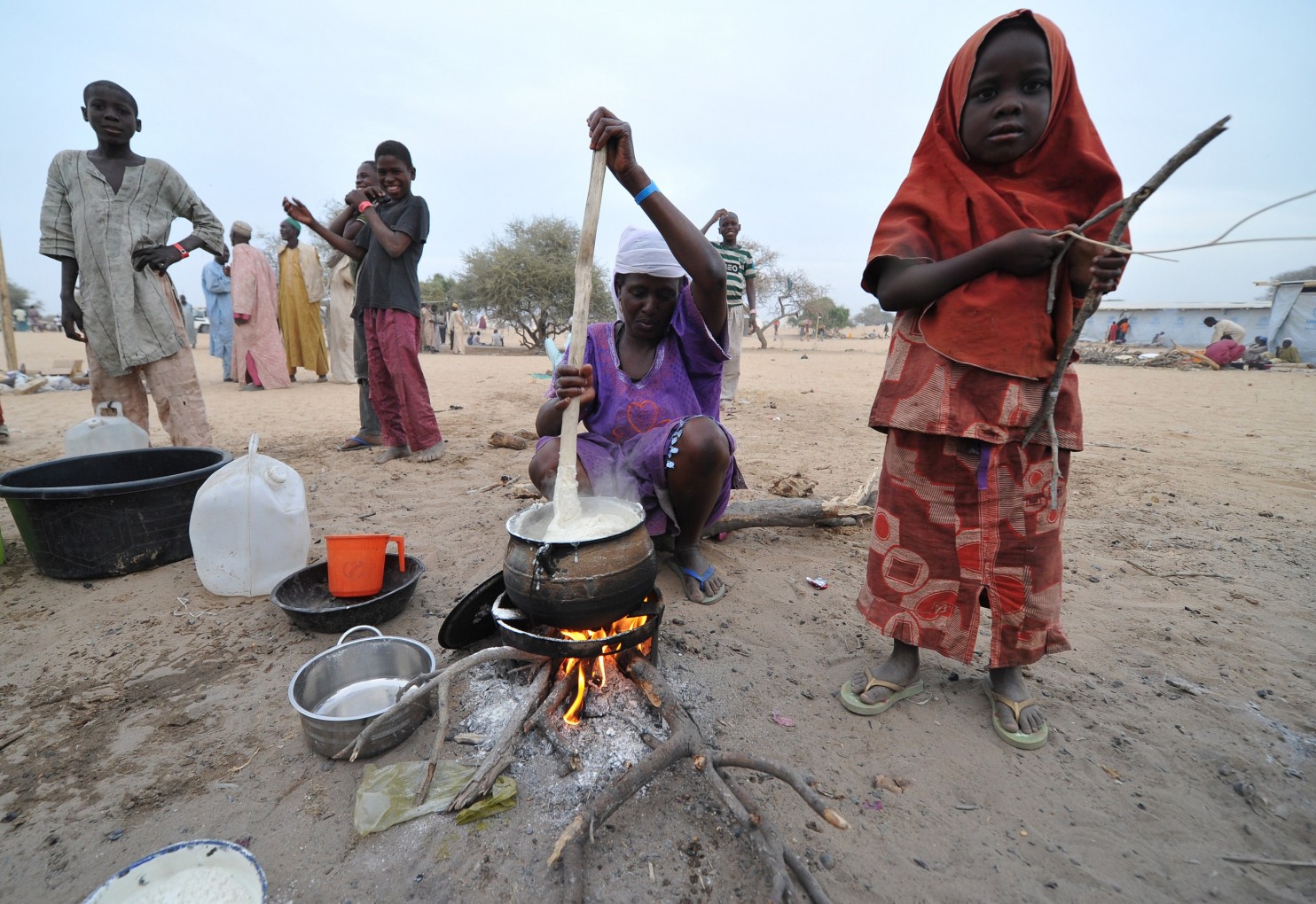Nigerian refugees prepare food and go about their daily lives at a United Nations High Commission for Refugees (UNHCR) camp in Baga Sola on January 29, 2015. The refugees arrived in the camp after the attack by Boko Haram millitants in the Nigerian town of Baga. (Sia Kambou/AFP/Getty Images)