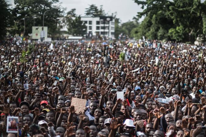 Supporters of Guy Brice Parfait, who leads a party in support of Republic of Congo President Denis Sassou Nguesso, attend a rally in Brazzaville, Republic of Congo, March 17. Republic of Congo is one of six countries and territories in Africa holding votes on Sunday.