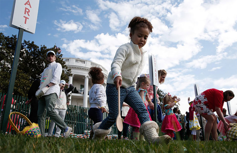 Young children roll Easter eggs on the South Lawn of the White House during the annual White House Easter Egg Roll March 28, 2016, in Washington, D.C.