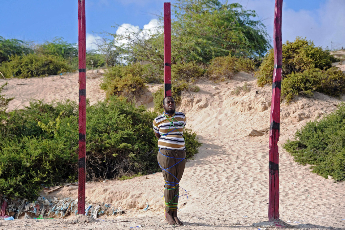 Journalist-turned-Islamist Hassan Hanafi Haji is tied to a post before being executed by firing squad at a police academy square in Mogadishu, Somalia, on April 11. 