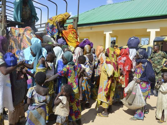 In this July 30, 2015, file photo, women and children rescued by Nigerian soldiers from the Islamic extremist group Boko Haram in the northeast of Nigeria, arrive at the military office in Maiduguri, Nigeria. (Photo: Jossy Ola, AP