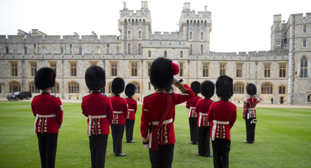 Royal Guardsman look out from the Quadrangle of Windsor Castle on April 22. 