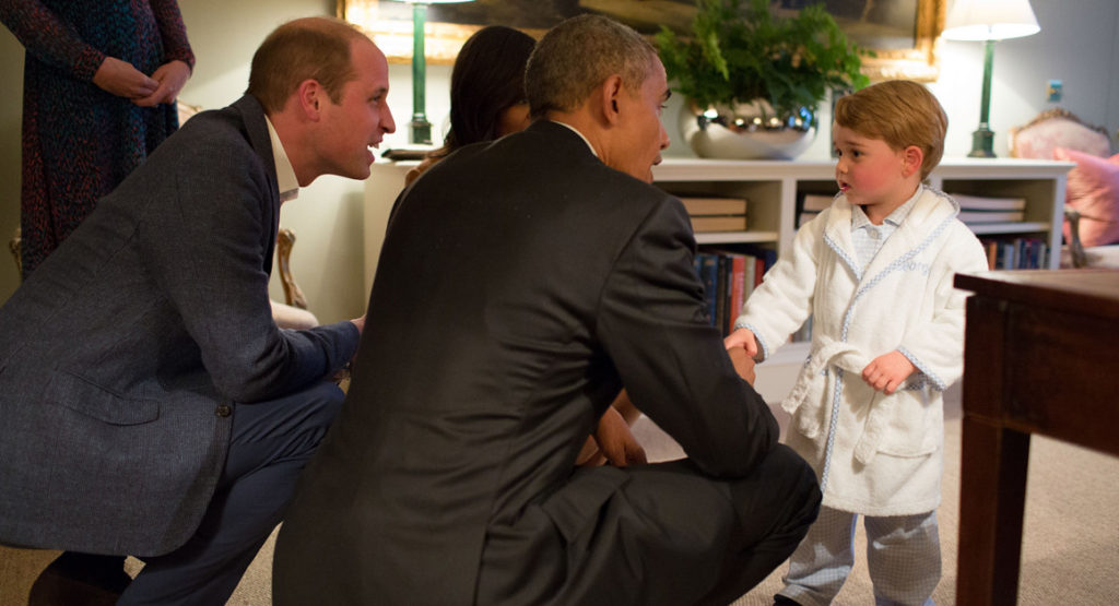 President Barack Obama, Prince William and First Lady Michelle Obama play with Prince George at Kensington Palace in London on April 22. 