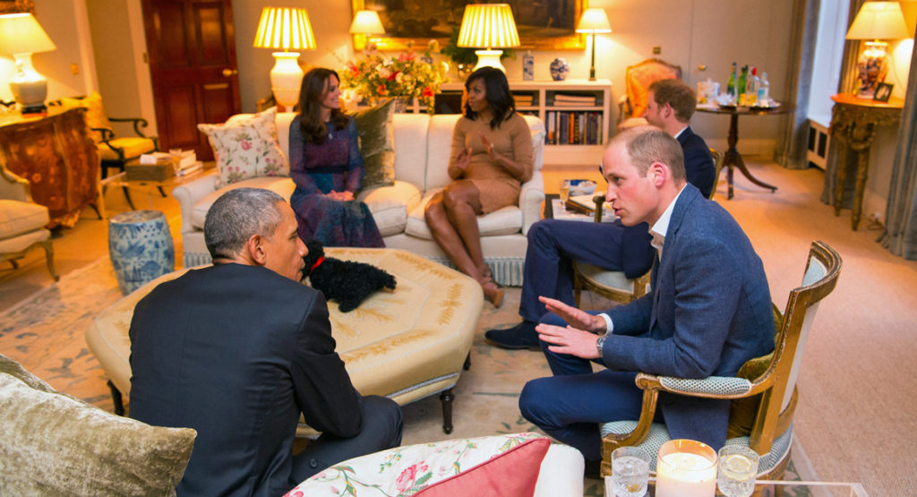 Britain's Prince William talks with President Obama as Kate Middleton and Michelle Obama talk while Prince Harry looks on at Kensington Palace in London on April 22. 