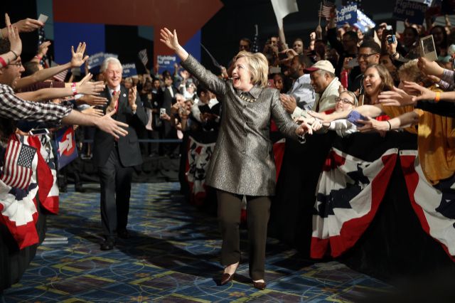 Hillary Clinton and her husband, former President Bill Clinton, walks to the stage at her election night rally in Philadelphia. (Photo: /Matt Rourke/AP)