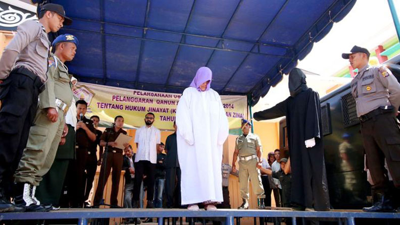 A 60-year-old Christian woman was caned in Aceh, a conservative Indonesian province, for selling alcohol. It was the first time someone from outside the Islamic faith has been punished there under strict religious laws.  (AFP/Getty Images)