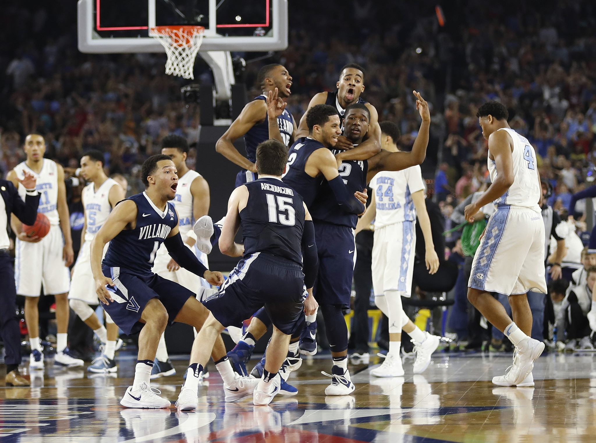 Villanova players celebrate after winning the national championship over North Carolina on Kris Jenkins' three-pointer at the buzzer. (David J. Phillip / Associated Press)