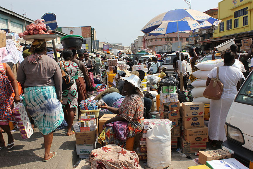 Customers peruse goods at Makola market in Accra, Ghana