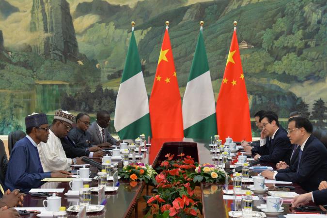 Nigeria's President Muhammadu Buhari (L) speaks with Chinese Premier Li Keqiang (R) at a meeting in the Great Hall of the People in Beijing, China, April 13. Buhari and his delegation have reportedly sought several Chinese loans during a state visit.