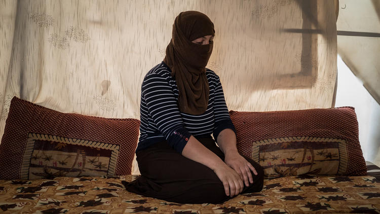 A Yazidi who had been held by Islamic State militants as a slave for several months sits in a tent outside Duhok, Iraq.  (Alice Martins, For The Washington Post)