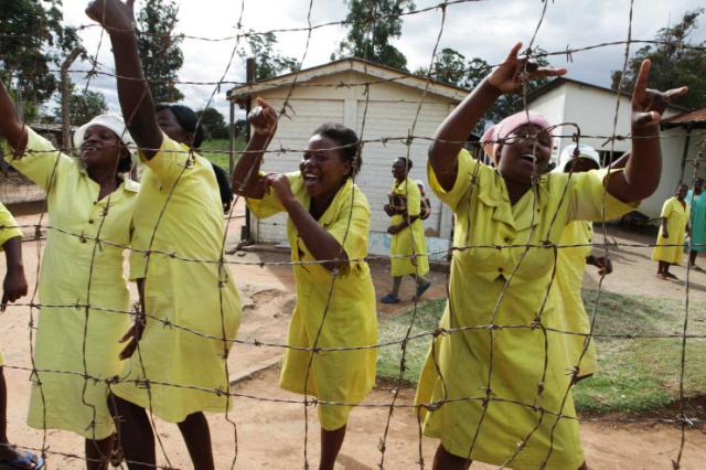 Female prisoners celebrate before their release at a maximum prison on the outskirts of Harare on Feb 17. (Tsvangirayi Mukwazhi/AP) 