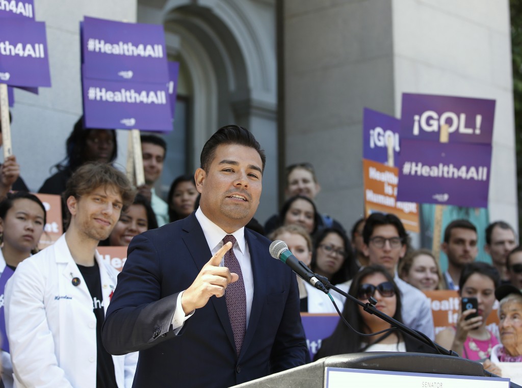 State Sen. Ricardo Lara, D-Bell Gardens, speaks at a rally where health care and immigrant rights advocates celebrated the expansion of Medi-Cal to children and teens illegally brought to the United States, held at the Capitol Monday, May 16, 2016, in Sacramento, Calif. 