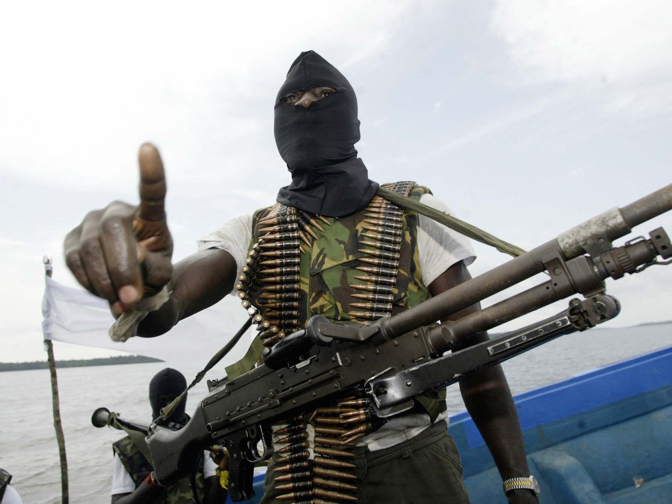 Militants patrolling the creeks of the Niger Delta area of Nigeria in 2006.