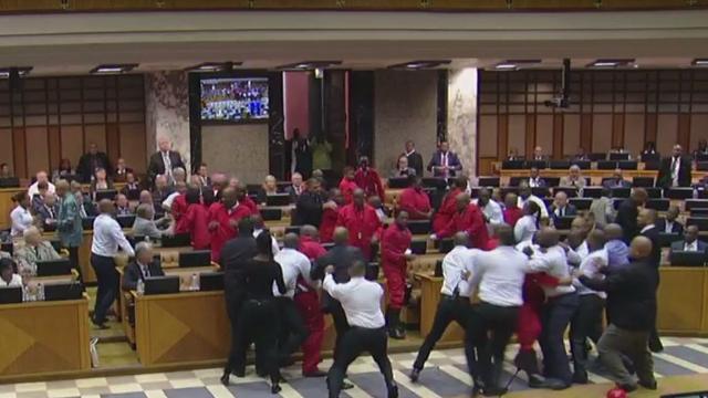 Security guards were ordered by the speaker to eject the people who were being disruptive. Guards surrounded the EFF MPs who were dressed in their trademark red boiler suits.
