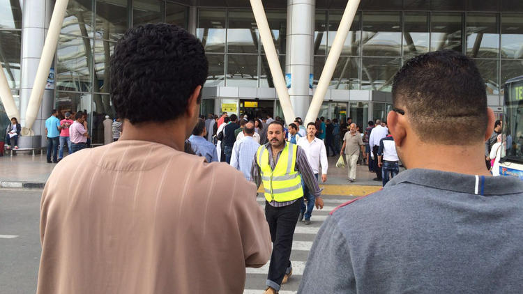 Egyptians gather outside the arrivals section of Cairo International Airport, Egypt, on May 19, 2016. An EgyptAir flight from Paris to Cairo carrying 66 people disappeared from radar early Thursday morning, the airline said.  (Amr Nabil / AP)