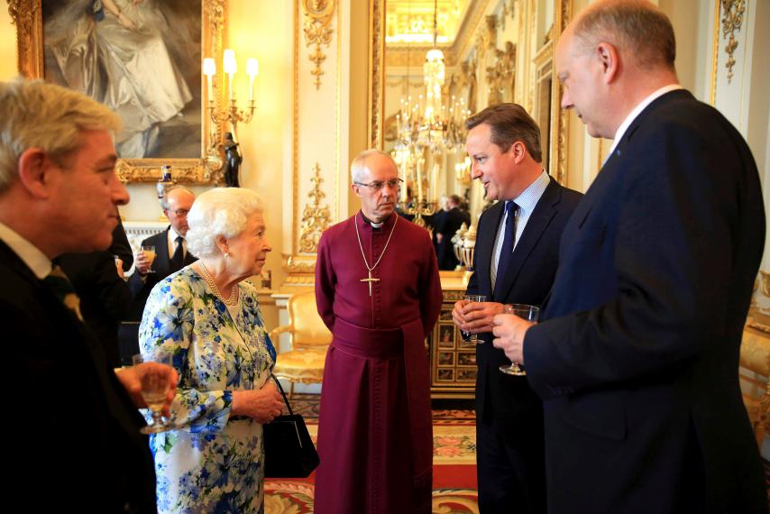 British Prime Minister David Cameron (2nd R), pictured speaking to Queen Elizabeth II and Archbishop of Canterbury Justin Welby at Buckingham Palace, May 10, has put his foot in it ahead of an anti-corruption summit in London. Paul Hackett - WPA Pool/Getty Images