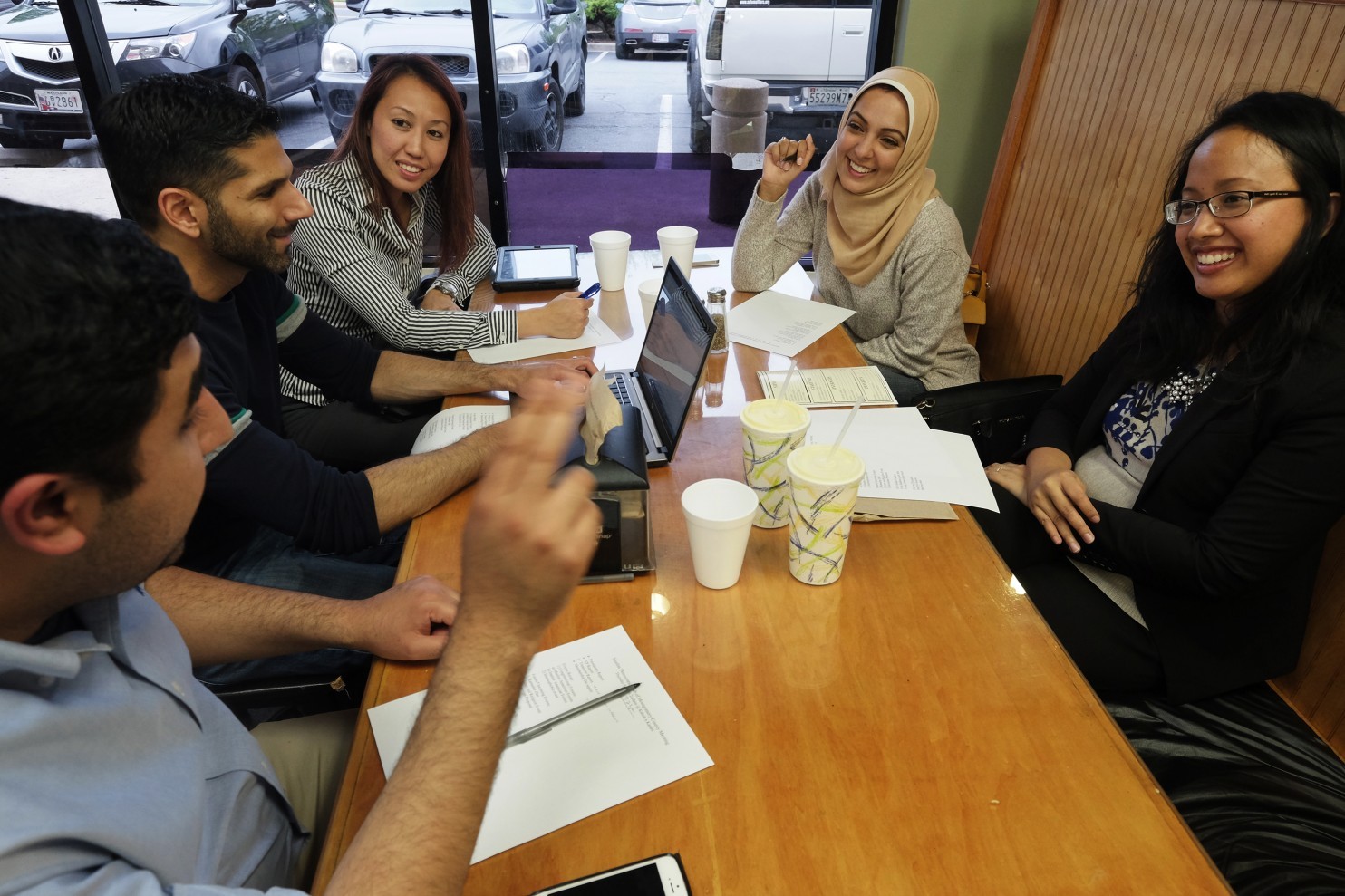 Members of the Muslim Democratic Club of Montgomery County meet in Silver Spring. From left: Hamza Khan, Hasan Mansori, Aminda Kadir, Rida Bukhari-Rizvi and Nadia Syahmalina. (Bonnie Jo Mount/The Washington Post)