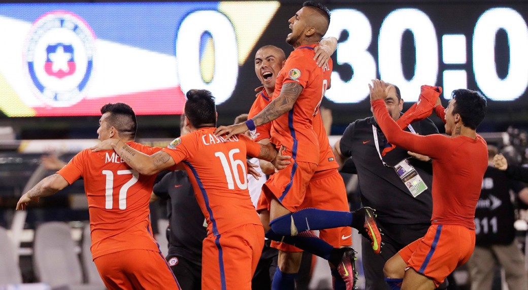 Chile players celebrates after defeating Argentina 4-2 in penalty kicks in the Copa America Centenario championship soccer match, Sunday, June 26, 2016, in East Rutherford, N.J. (Matt Slocum/AP) EAST RUTHERFORD, N.J. -- Lionel Messi still awaits his first title with Argentina's national team. Messi put his penalty kick over the crossbar, Francisco Silva converted Chile's final shot and La Roja won their second straight Copa America title by beating Argentina 4-2 on penalty kicks following a 0-0 tie Sunday night.