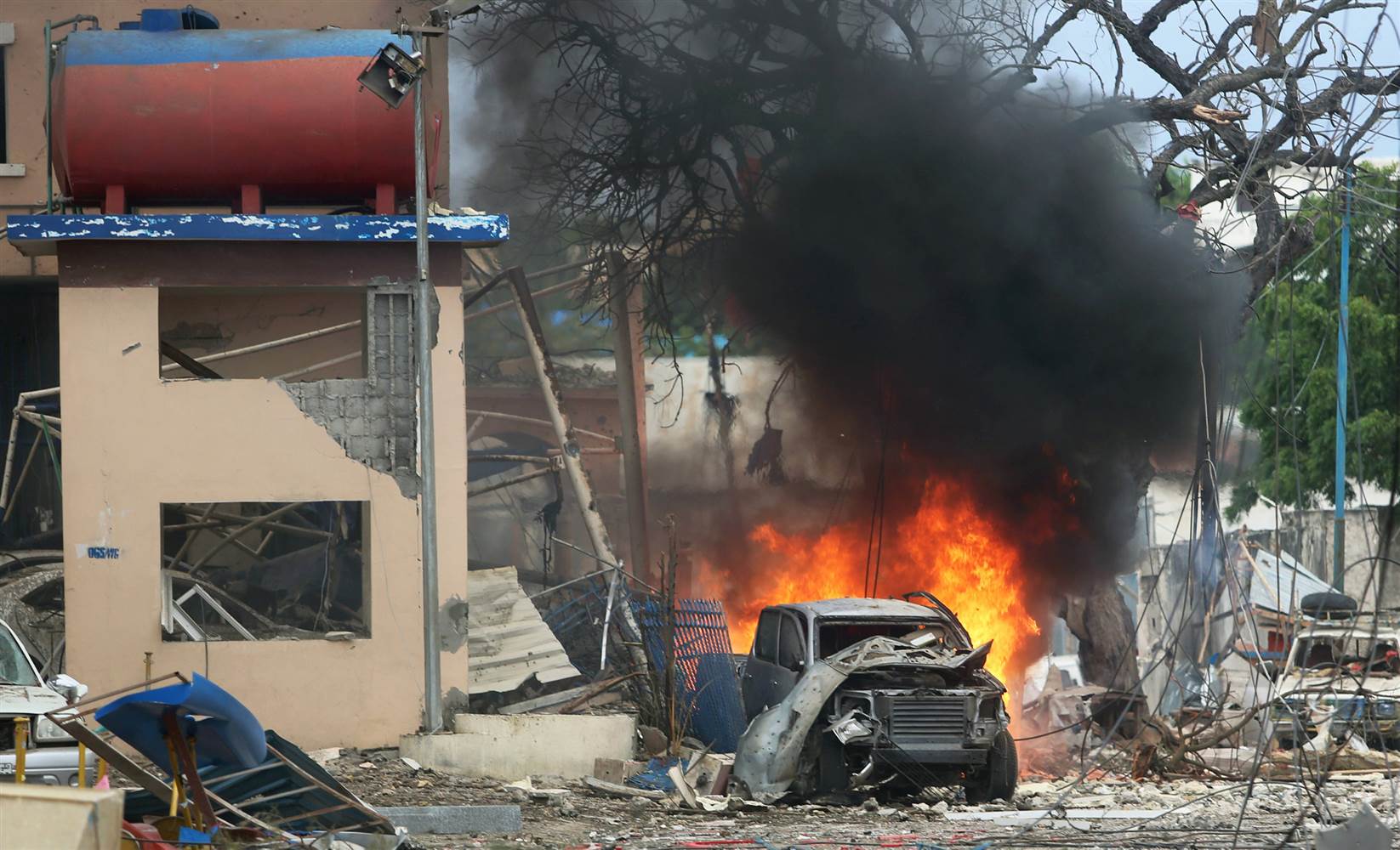 A vehicle burns at the scene of a suicide bomb attack 