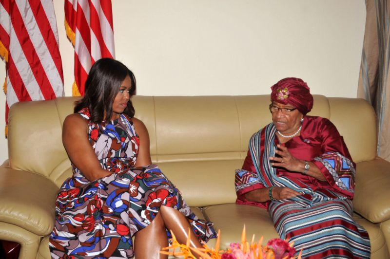 U.S. First lady Michelle Obama, left, listens to Liberian President Ellen Johnson Sirleaf.