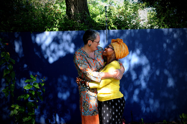 CAPE TOWN, SOUTH AFRICA MARCH 12 (SOUTH AFRICA OUT): The daughter of Archbishop Emeritus Tutu, Reverend Mpho Tutu and her wife, Professor Marceline Furth embrace during an interview on March 12, 2016 at their home in Cape Town, South Africa. The two celebrated their union in an intimate wedding ceremony. (Photo by Lerato Maduna/Foto24/Gallo Images/ Getty Images)