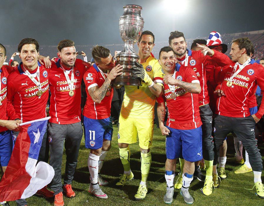 Chilean goalkeeper Claudio Bravo and teammates celebrate after winning the Copa America Cup.