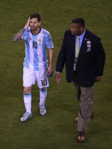 Dejected after penalty miss...Lionel Messi leaves the field after his missed penalty contributed to Argentina's shoot-out loss. 
