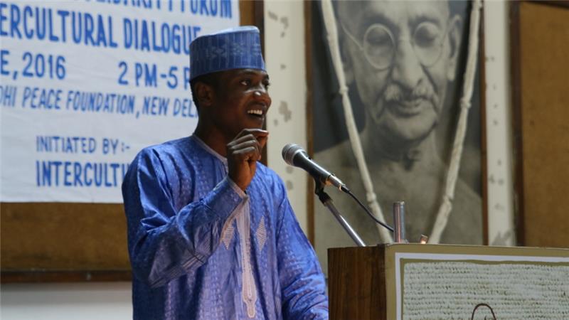 Zaharaddeen Muhammed, a master's degree student from Nigeria living in India, speaks at the Africa-India Solidarity Forum in New Delhi [Aletta Andre/Al Jazeera]