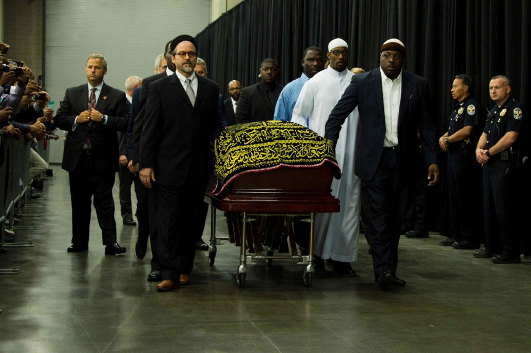 Pallbearers escort the casket of boxing legend Muhammad Ali during the Jenazah prayer service.