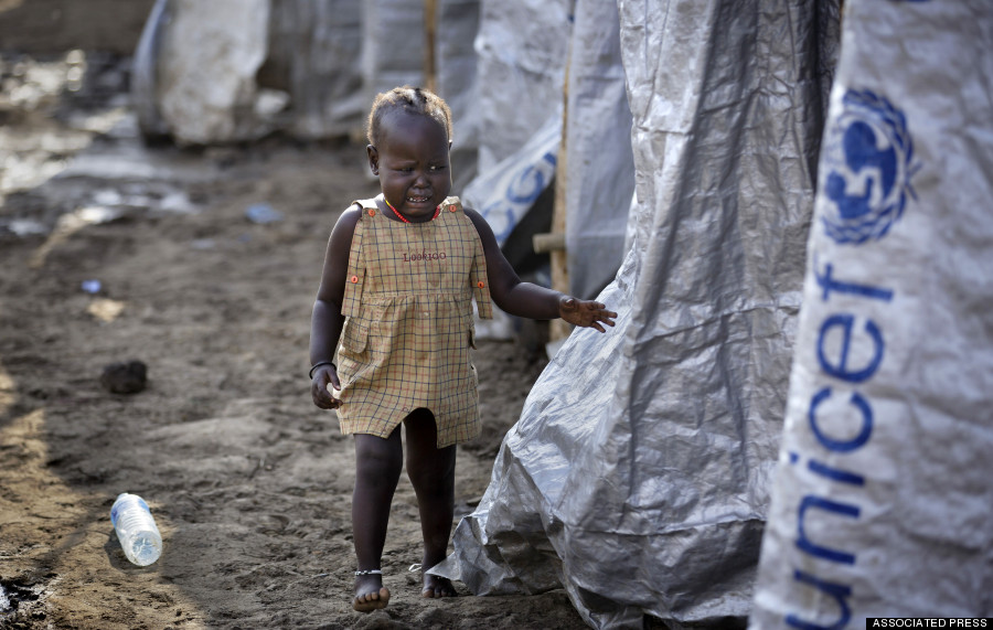 File photo: A young displaced girl starts crying after the relative she was with disappears into a row of latrines, at a United Nations compound which has become home to thousands of people displaced by the  fighting, in the capital Juba, South Sudan.