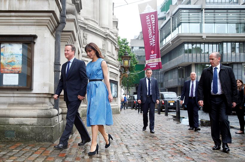 David Cameron, left, and his wife Samantha arrive to vote in the EU referendum in London, Thursday June 23, 2016. Cameron has announced his resignation as Prime Minister following the UK's historic vote to leave the EU. He refused to give an exact time table for his departure, but said that he wanted a new leader to be in place by the start of the Tory Party conference in October.