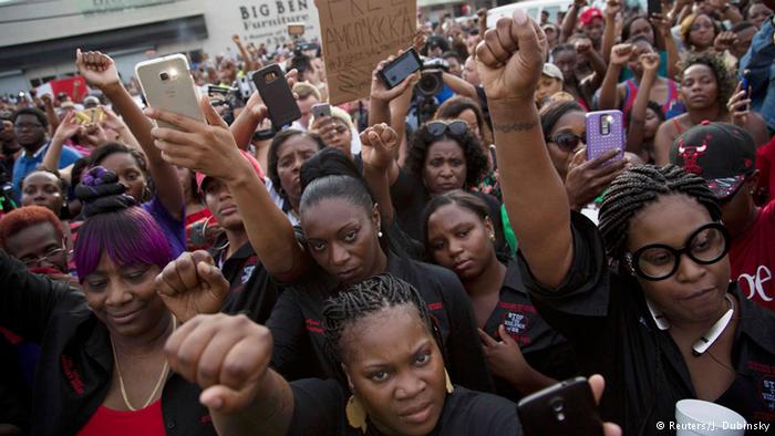 Community members attend a vigil for Alton Sterling, who was shot dead by police.