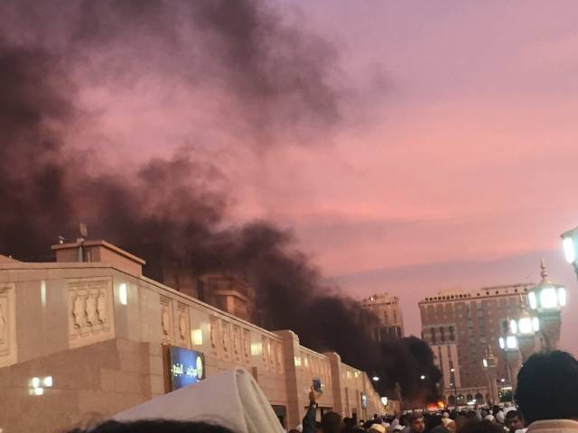 Muslim worshippers gather after a suicide bomber detonated a device near the security headquarters of the Prophet's Mosque in Medina, Saudi Arabia, July 4, 2016. PHOTO: TWITTER/@nbbrk