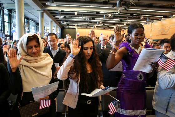 New U.S. citizens take the Oath of Allegiance during an Independence Day naturalization ceremony held by U.S. Citizenship and Immigration Services for 503 people at Seattle Center in Seattle, Washington.