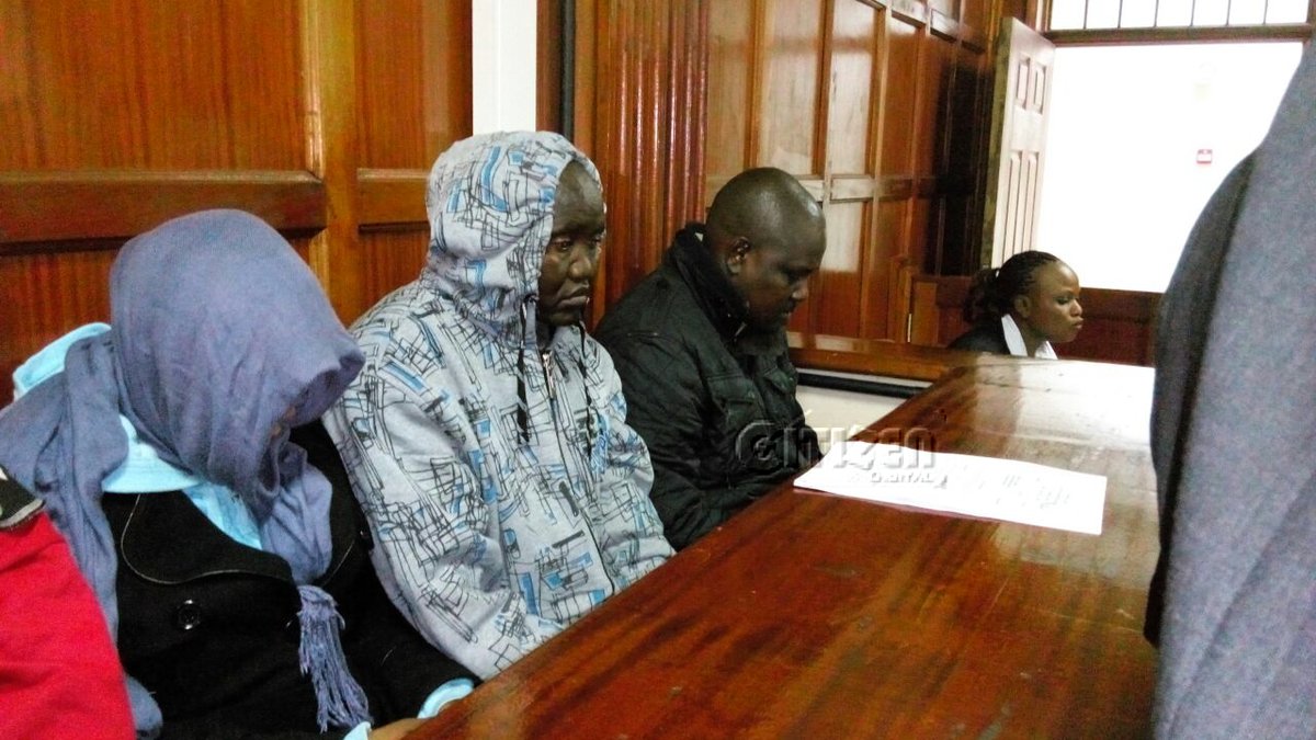 Three police officers suspected to be behind killing of lawyer and 2 others were arraigned in court.