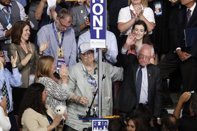 Standing with the Vermont delegation Sen. Bernie Sanders, I-VT., waves after asking that the delegates make Hillary Clinton the unanimous choice for President of the Untied States during the second day of the Democratic National Convention in Philadelphia , Tuesday, July 26, 2016. (Photo: Mary Altaffer/AP) 