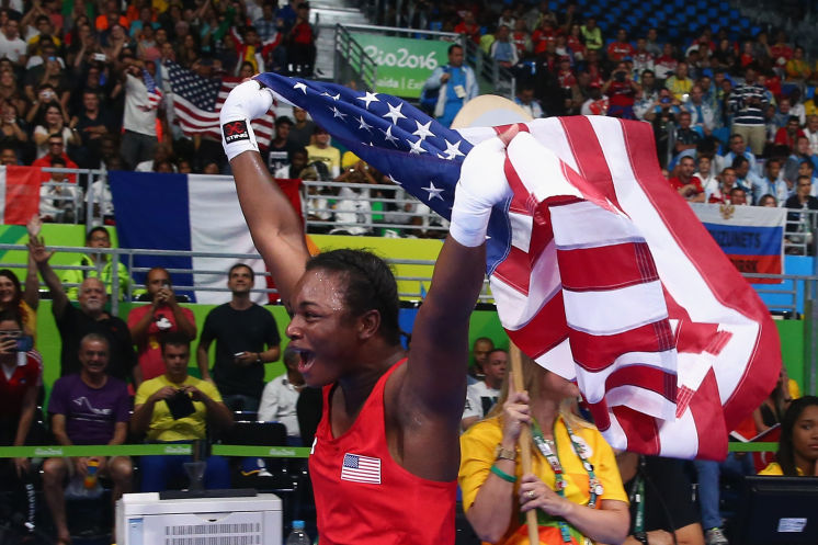 Claressa Shields becomes the first U.S. boxer, woman or man, with two gold medals after defending her 2012 title. 