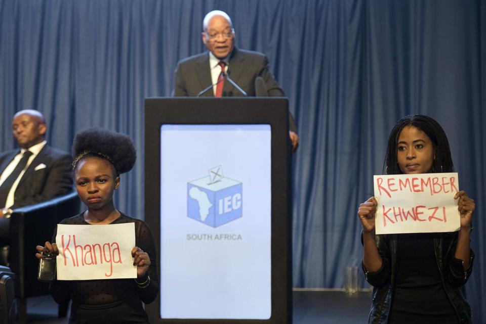 South African President Jacob Zuma spoke about the election on Saturday as protesters stood silently with signs referring to his acquittal on rape charges in 2006.