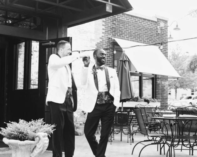 Eric and David take a moment to dance outside in the sun after celebrating their wedding together