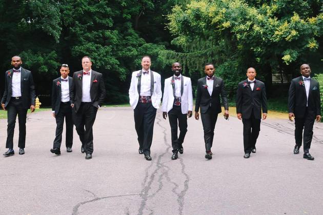 The groomsmen take a stroll before the reception