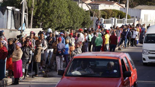 People stand in line to vote outside a polling station during municipal elections in Khayelitsha township on the outskirts of Cape Town, South Africa.  Last  municipal elections were described as the most closely contested for the African National Congress since it took power in the first all-race elections in 1994. About 26 million people had registered to vote at more than 22,000 polling stations as the ANC sought to retain control of key metropolitan areas despite a vigorous challenge from opposition parties. 