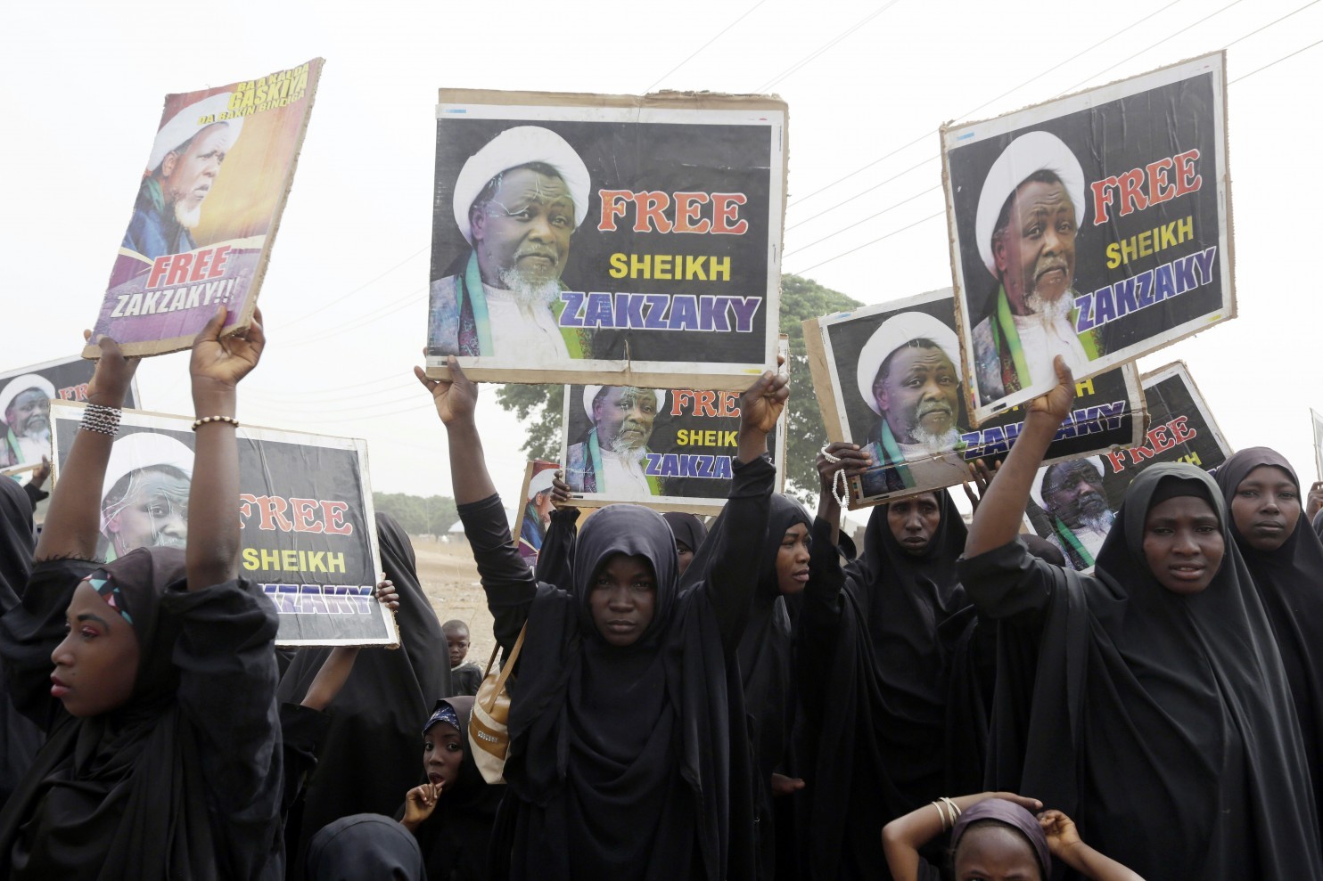 FILE- In this Friday April 1, 2016 file photo, Nigerian Shiite Muslims take to the street to protest and demanded the release of Shiite leader Ibraheem Zakzaky in Cikatsere, Nigeria. Nigeria’s army gunned down 348 Shiites in an attack in which one soldier was killed, according to the report of a commission of inquiry published Monday, Aug. 1, 2016 which calls for all those involved in the killings to be prosecuted. (Sunday Alamba, file/Associated Press) 