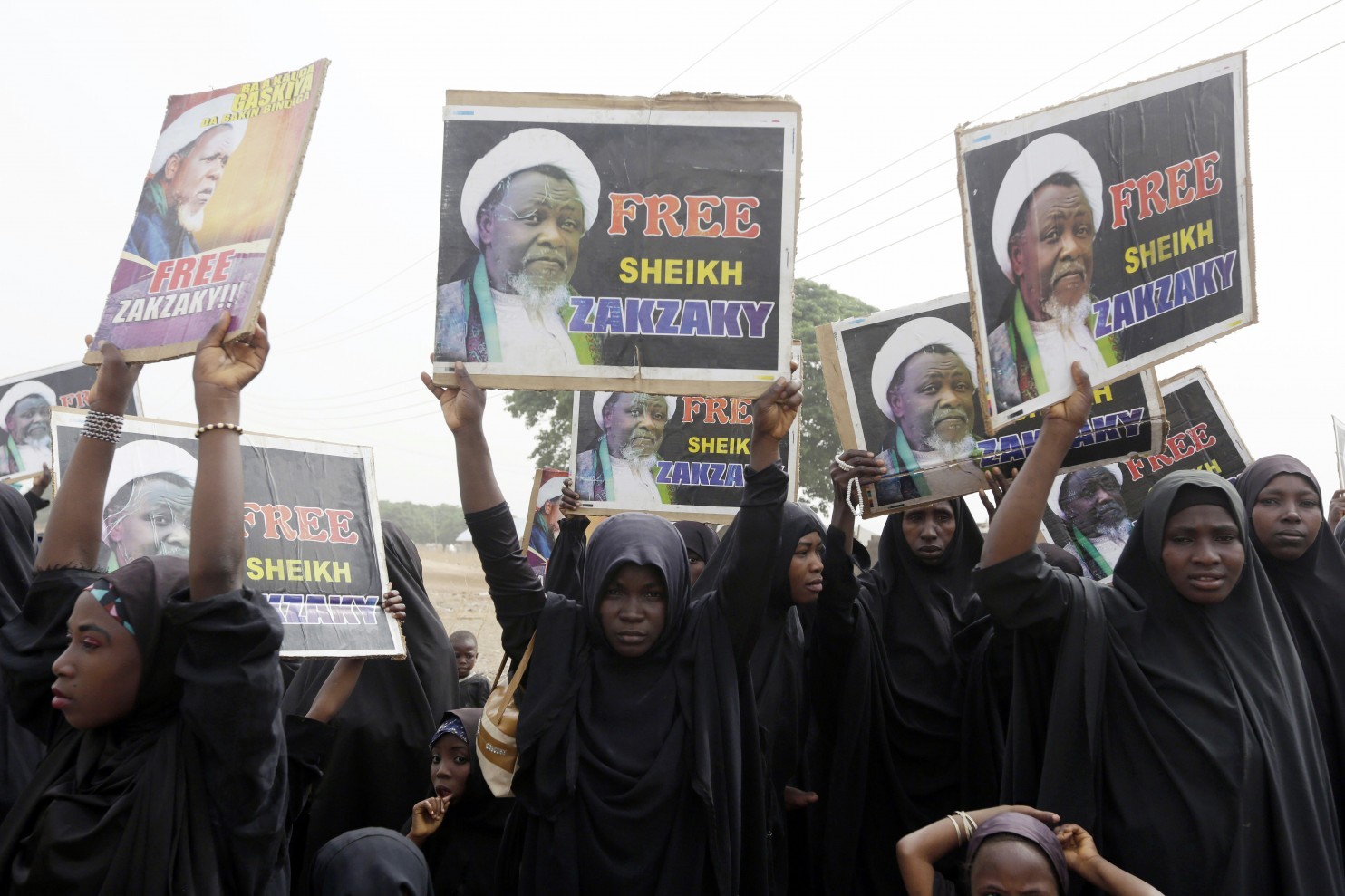FILE- In this Friday April 1, 2016 file photo, Nigerian Shiite Muslims take to the street to protest and demanded the release of Shiite leader Ibraheem Zakzaky in Cikatsere, Nigeria. Nigeria’s army gunned down 348 Shiites in an attack in which one soldier was killed, according to the report of a commission of inquiry published Monday, Aug. 1, 2016 which calls for all those involved in the killings to be prosecuted. (Sunday Alamba, file/Associated Press)