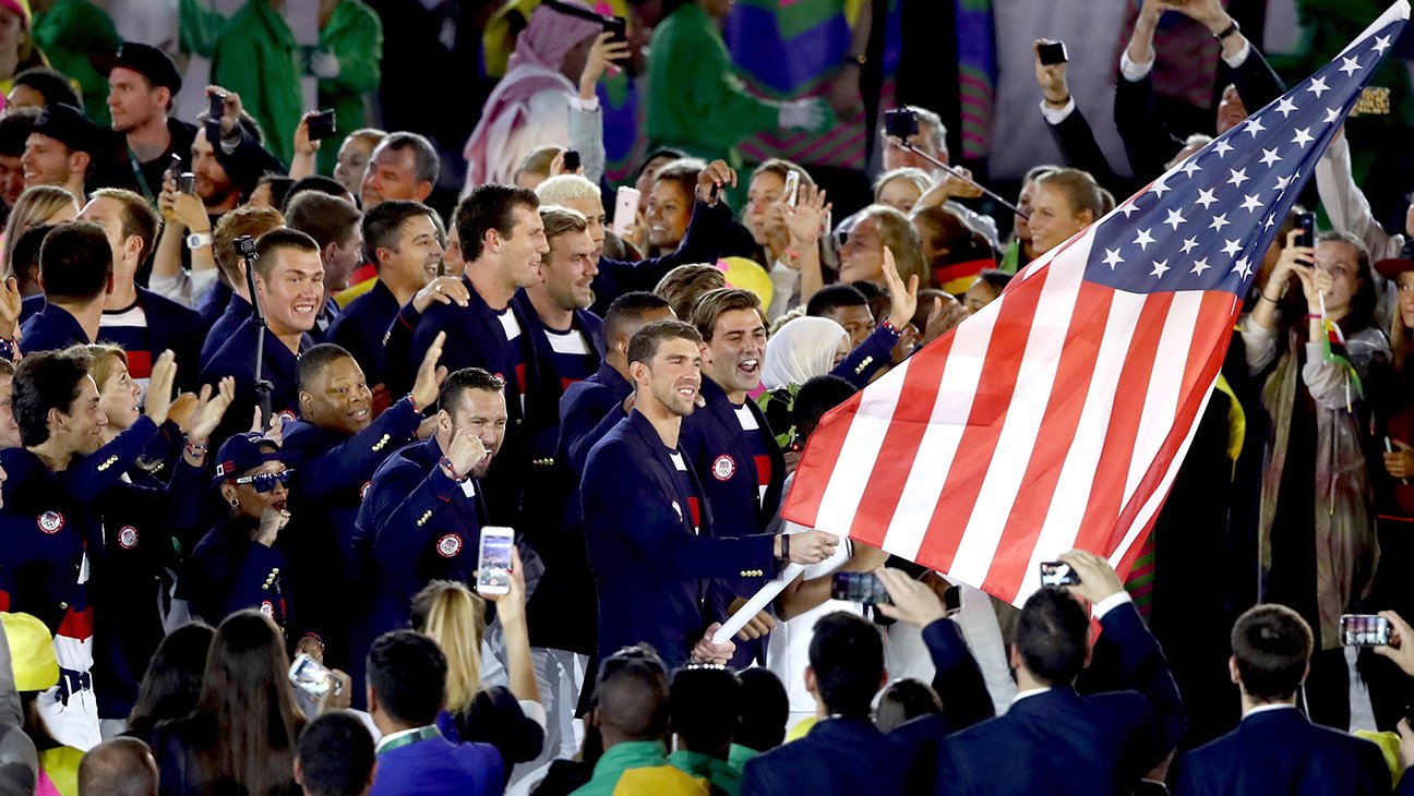 Flag bearer Michael Phelps and Ibtihaj Muhammad lead the U.S. Olympic team during the parade of nations.