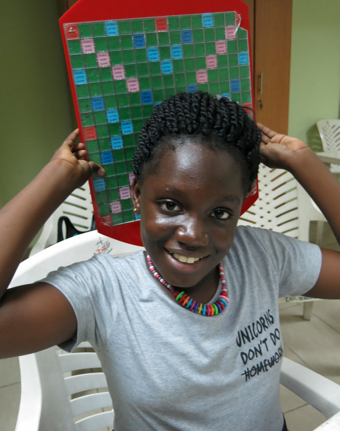 Angela "I'm not very shy!" Osaigbovo, 10, of Nigeria came in second in a recent youth tournament, and triumphed at Scrabble camp in August. She'd hoped to win the MSI World Youth Scrabble Championship in Lille, France, this weekend, but was refused a French visa.  Ofeibea Quist-Arcton/NPR  hide caption