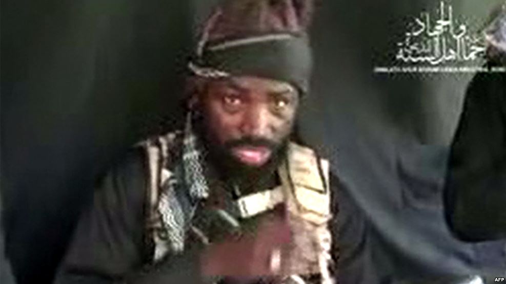 This screen grab image taken on September 25, 2016 from a video released on Youtube by Islamist group Boko Haram shows Boko Haram leader Abubakar Shekau making a statement at an undisclosed location. 